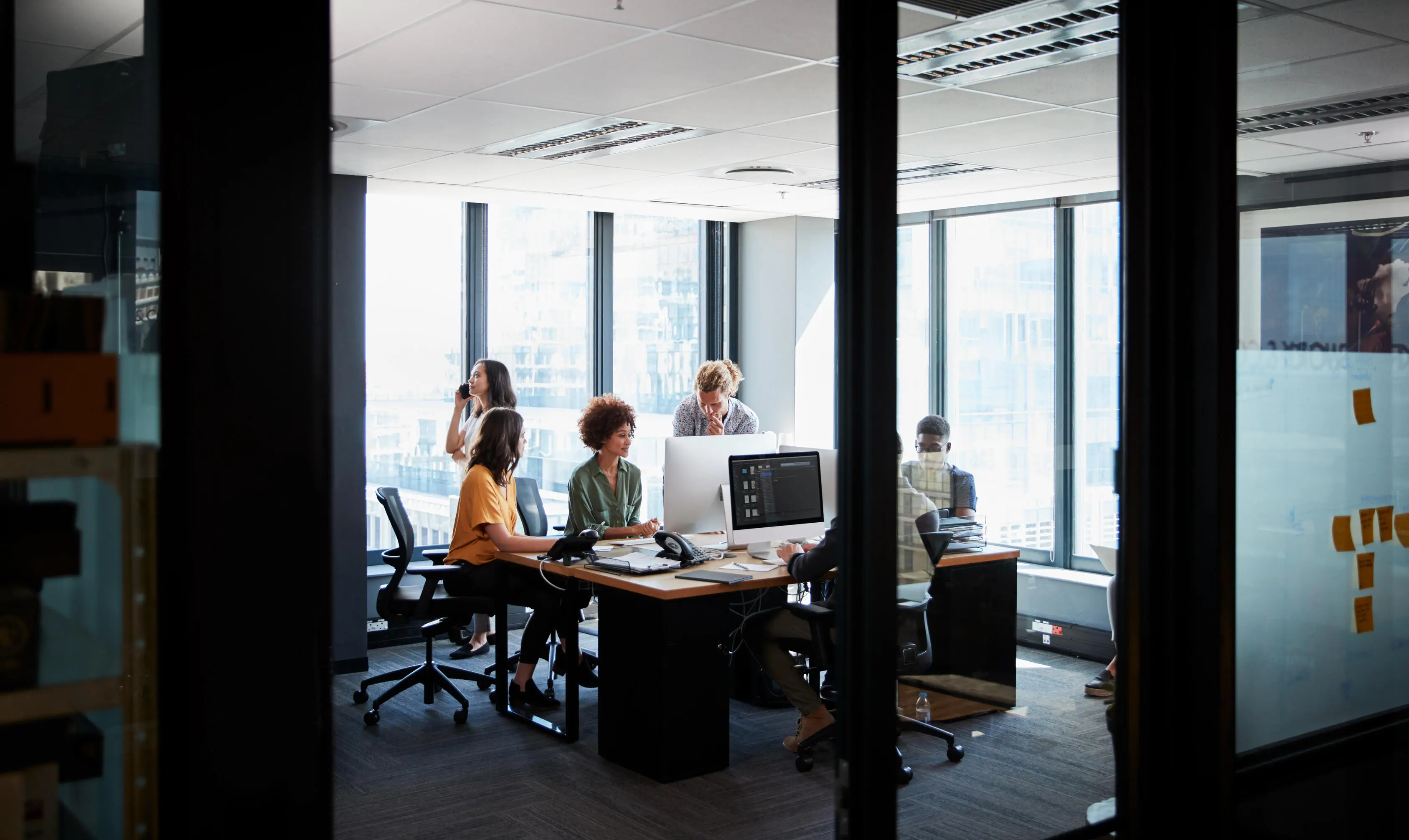 Creative business team actively collaborating in office space